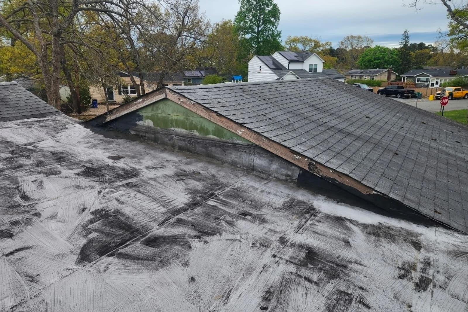 Before — the same Toms River roof, worn and weather-beaten